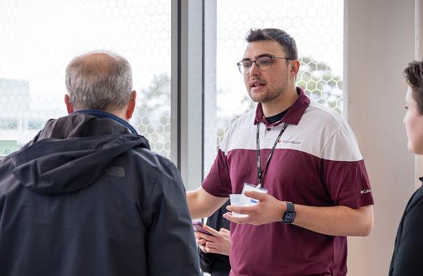 Caileb explaining Energy Systems Technology project during Ideas to Impact event